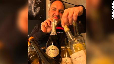 Ukrainian winemaker Eduard Gorodetsky with a selection of regional wines at his Odesa bar and wine shop. He says &quot;buying Ukrainian&quot; is seen as more affordable and patriotic. 