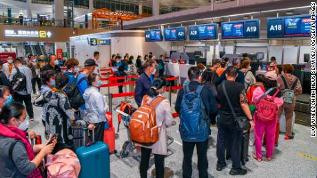 Passengers heading to Singapore checking in at Haikou Airport in China&#39;s Hainan province on March 15.