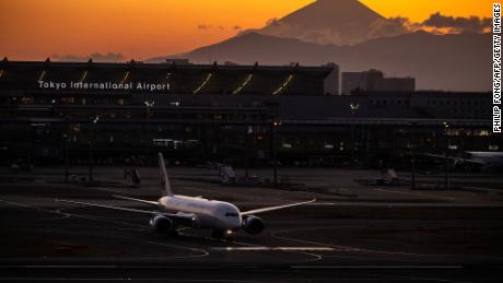 A Japan Airlines plane, pictured with Mount Fuji in the background at Haneda Airport in Tokyo in February.