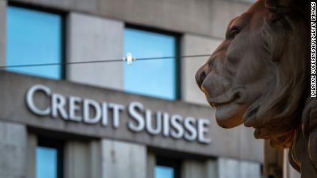 A sign of Credit Suisse bank is seen on a branch building in Geneva, on March 15, 2023. Credit Suisse shares nosedived on March 15, 2023, after its main shareholder said it would not provide more funding, with reassuring comments from the Swiss bank&#39;s chairman unable to calm the market panic. 