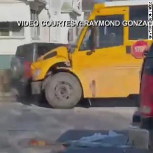 Watch moment stolen car crashes into school bus filled with kids