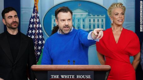 Jason Sudeikis is flanked by fellow Ted Lasso cast members Brett Goldstein and Hannah Waddingham as he takes questions at the daily press briefing in the Brady Press Briefing Room at the White House in Washington, U.S., March 20, 2023. REUTERS/Kevin Lamarque