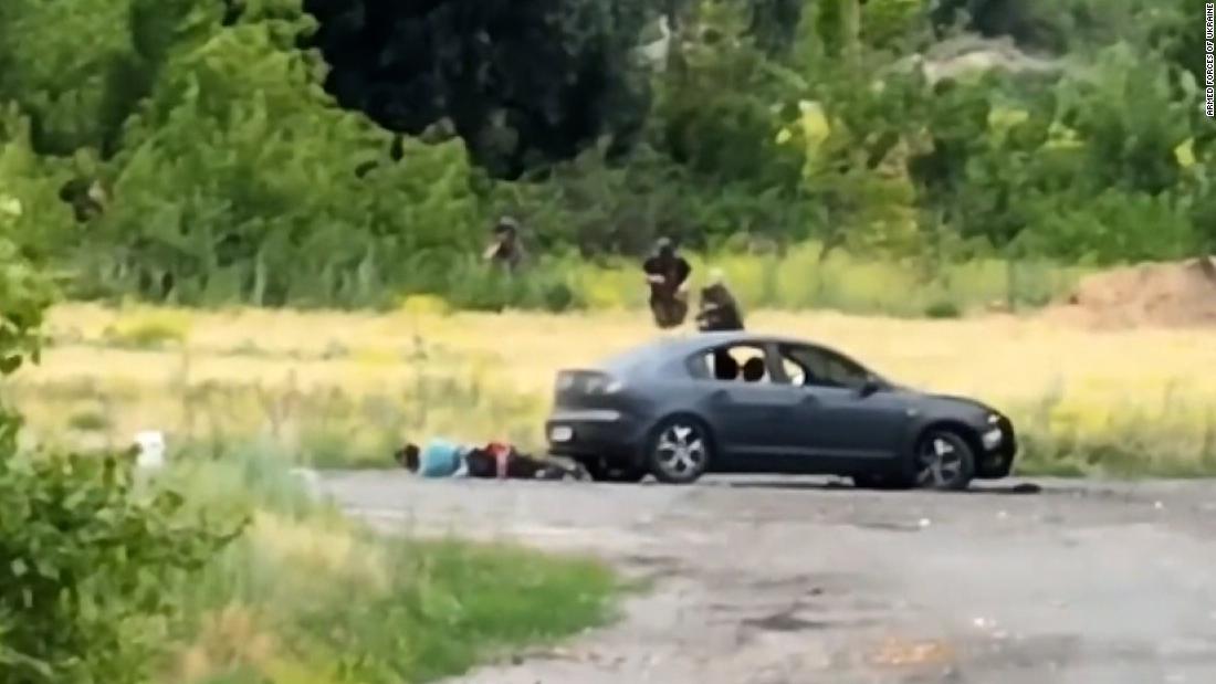 Russian soldiers emerge from forest after couple makes wrong turn on their drive