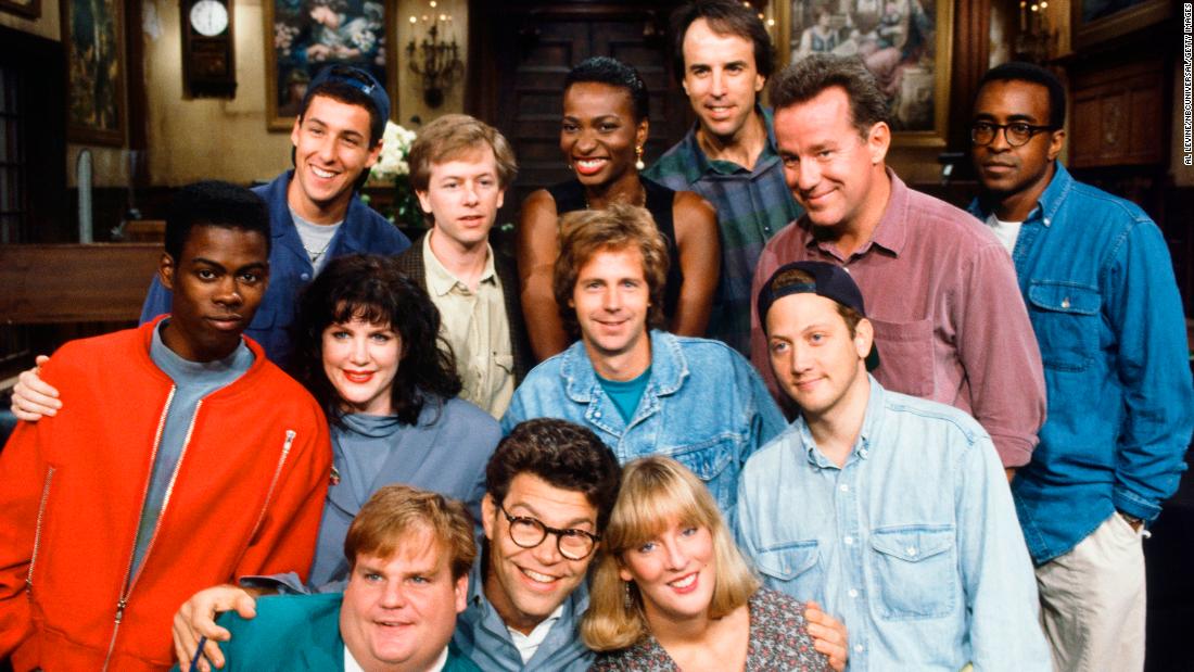 Sandler, top left, poses with other members of the &quot;Saturday Night Live&quot; cast in 1992. Before he joined the cast, Sandler was a writer for the show. With him in the top row, from left, are David Spade, Ellen Cleghorne, Kevin Nealon, Phil Hartman and Tim Meadows. In the second row are Chris Rock, Julia Sweeney, Dana Carvey and Rob Schneider. At the bottom are Chris Farley, Al Franken and Melanie Hutsell.