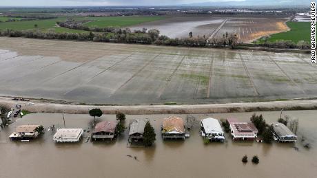 Houses sit partly underwater after the San Joaquin River flooded following rainstorms in Manteca, California on Sunday.