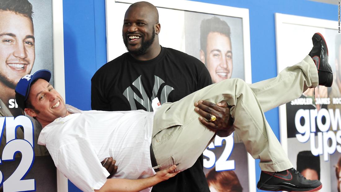 Basketball legend Shaquille O&#39;Neal gives Sandler a lift at the &quot;Grown Ups 2&quot; premiere in 2013.
