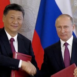 See how Russians and Chinese residents are reacting to a Putin and Xi alliance