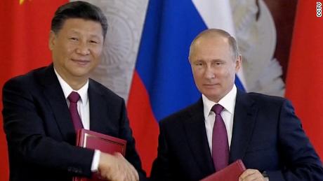 See how Russian and Chinese residents are reacting differently to a Putin and Xi alliance 