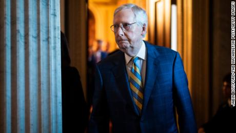 Senate Minority Leader Mitch McConnell walks to a press conference following a weekly policy luncheon on Capitol Hill on Tuesday, March 7, in Washington, DC.