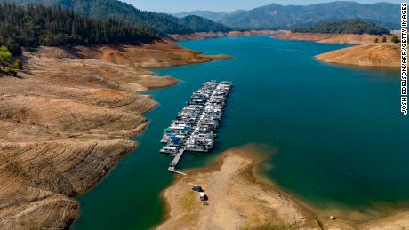 Boats are parked at the drought-ridden Shasta Lake in Lakehead, California on October 16, 2022.