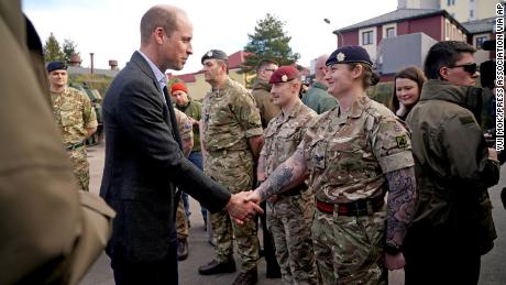 Prince William greeted members of the British military during the visit.