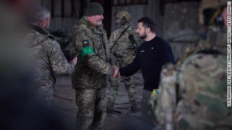 Ukrainian President Volodymyr Zelenskyy shakes hands with a Ukrainian soldier during his visit to the Bakhmut frontline in Donetsk region, Ukraine on March 22.