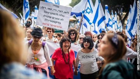Women dance during protests against Netanyahu&#39;s contentious judicial reforms in Tel Aviv on March 22, 2023.