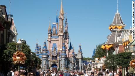 Visitors walk along Main Street at The Magic Kingdom as Walt Disney World reopens following Hurricane Ian on September 30, 2022 in Orlando, Florida. 