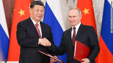 Chinese leader Xi Jinping and Russian President Vladimir Putin shake hands after signing a joint statement during Xi&#39;s state visit to Moscow in March 2023. 