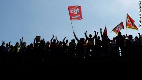 Protesters, holding CGT labor union flags, attend a demonstration against the pension reform in Nice, France, on March 23, 2023.      