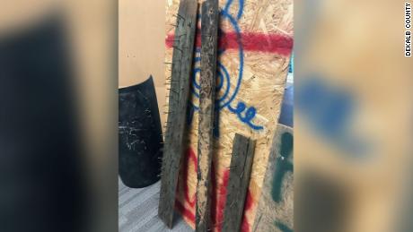 A DeKalb County official said hidden traps, including boards with nails hidden by leaves and underbrush, were found at the park.