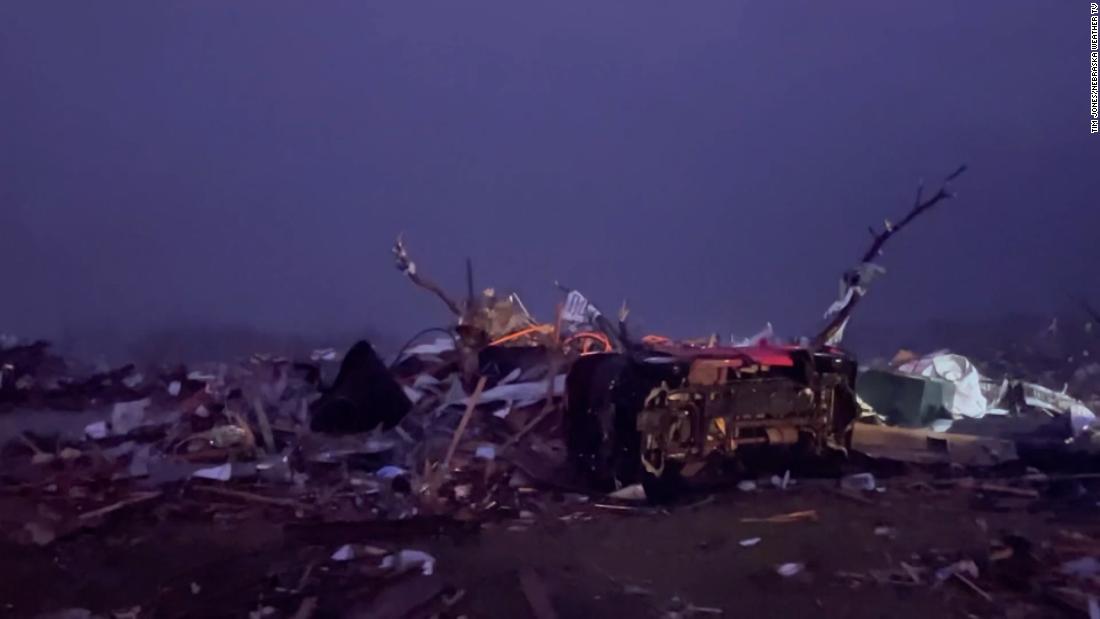 Some residents survived the tornado by sheltering in a freezer. Storms uprooted homes and trees. At least 24 people are dead and dozens are missing.
