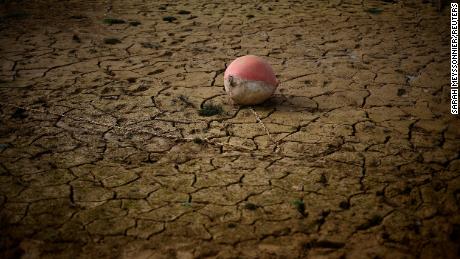 A buoy is seen on the banks of the partially dry Lake Montbel as France faces a record winter dry spell.