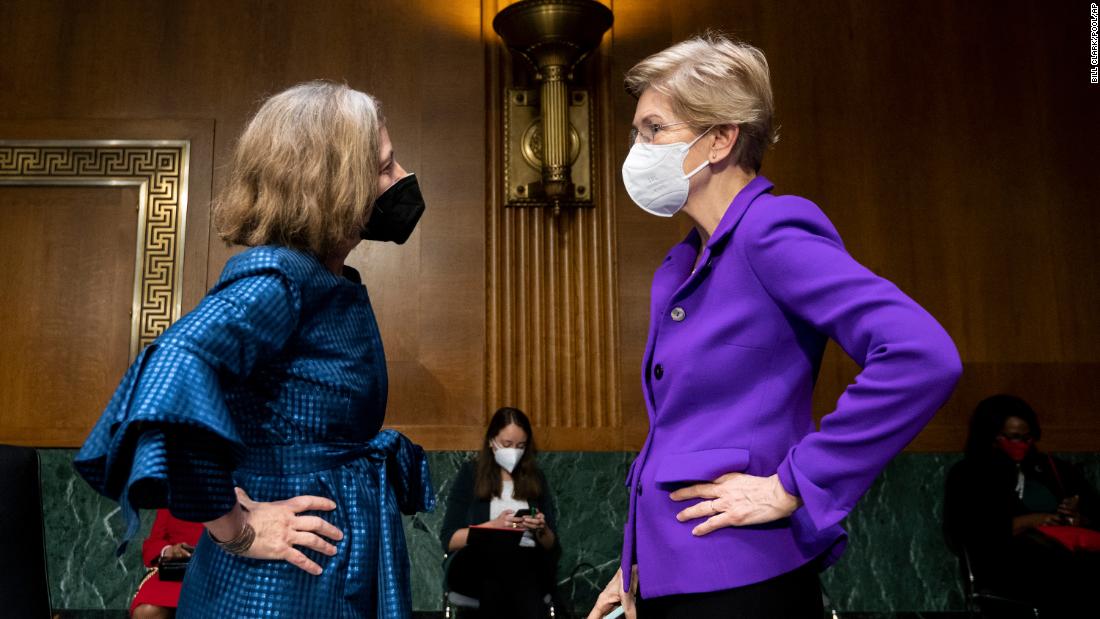 Sen. Elizabeth Warren talks with Federal Reserve&#39;s Board of Governors nominee Sarah Bloom Raskin before a Senate hearing in February 2022.