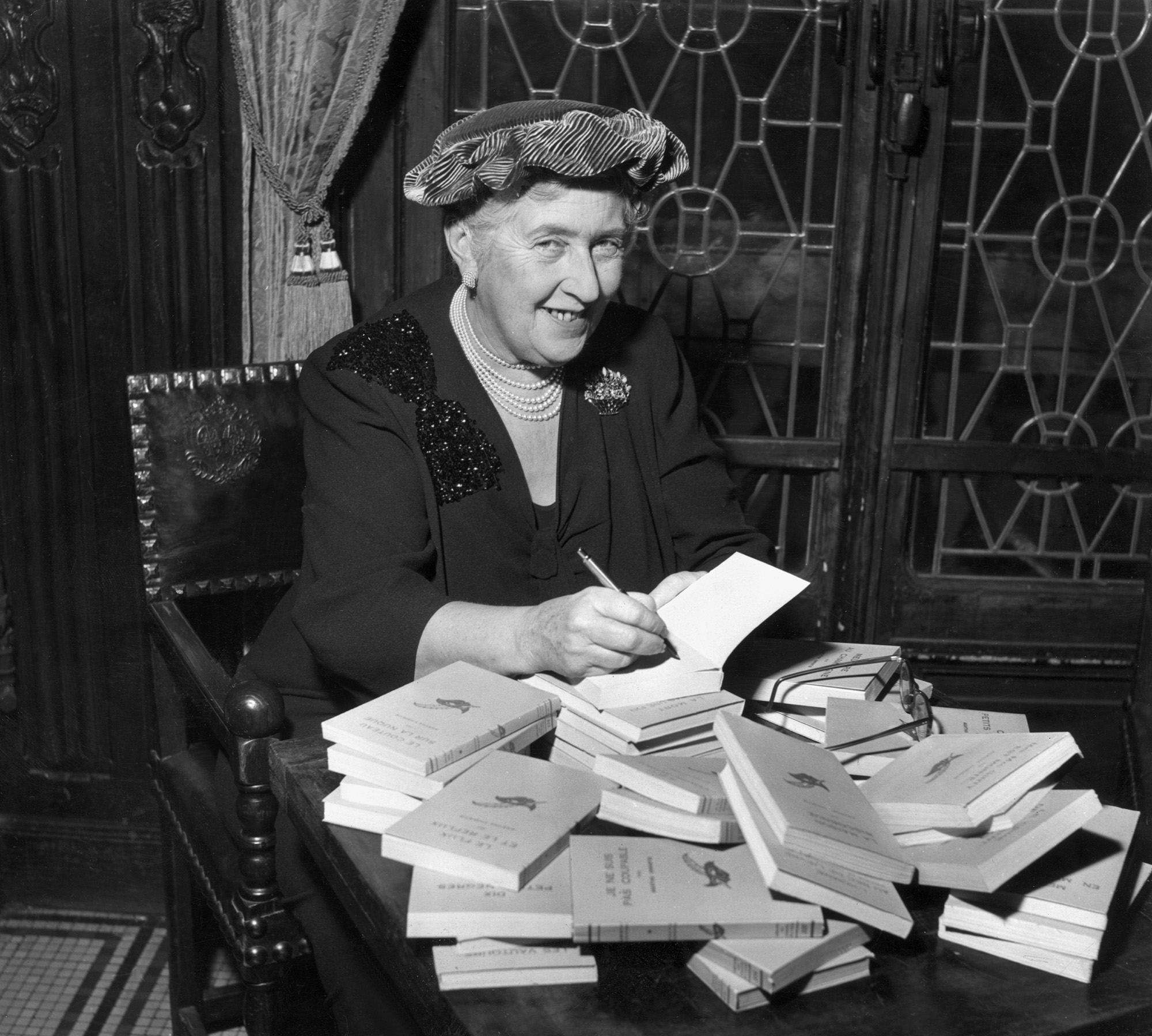 Agatha Christie signing books.