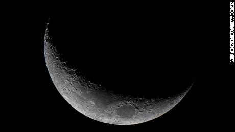 The Waxing Crescent moon is seen from Panama City on March 25, 2023. (Photo by Luis ACOSTA / AFP) (Photo by LUIS ACOSTA/AFP via Getty Images)