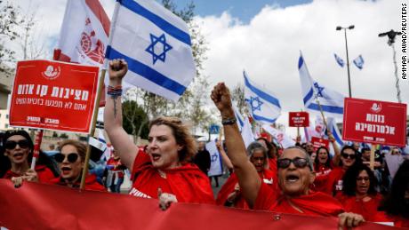 Women dressed as handmaidens from &quot;The Handmaid&#39;s Tale&quot; attend a demonstration after Israeli Prime Minister Benjamin Netanyahu dismissed the defense minister and his nationalist coalition government presses on with its judicial overhaul, in Jerusalem, March 27, 2023.