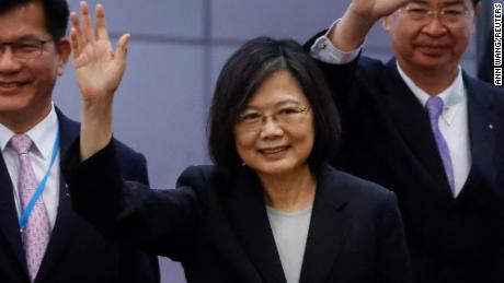 Taiwan&#39;s President Tsai Ing-wen waves near the boarding gate as she departs for a 10-day international trip on March 29, 2023. 
