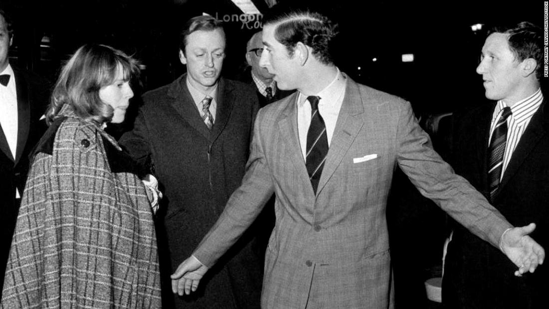 Camilla and her husband, Andrew, leave the Royal Opera House with Prince Charles in February 1975. Camilla and Charles reportedly met at a polo match in 1970 and became friends.