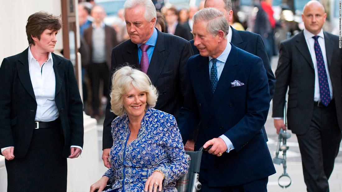 Charles pushes Camilla in a wheelchair as they attend the premiere of &quot;Aida&quot; at the Royal Opera House in London in April 2010. She had suffered a broken leg weeks prior. 