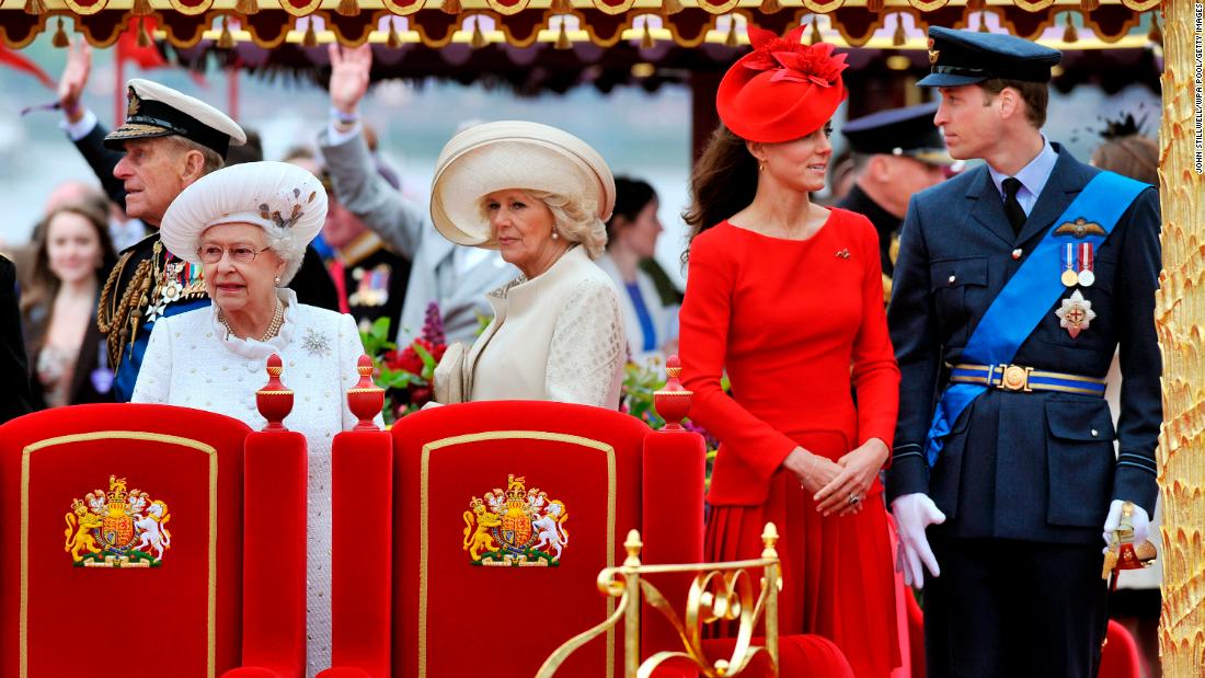 Camilla stands next to Queen Elizabeth II during a Diamond Jubilee pageant on the River Thames in June 2012. At right are Prince William and his wife, Catherine.