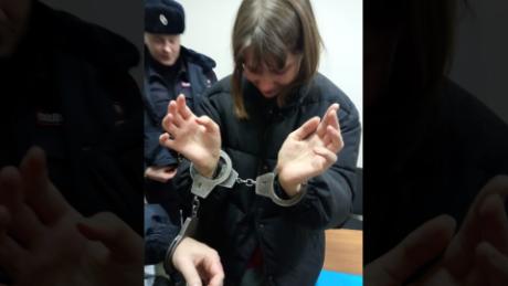 Olesya Krivtsova seen in handcuffs.
