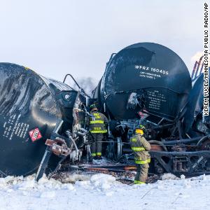 Crews work to put out blaze after train carrying highly flammable ethanol derailed in Minnesota