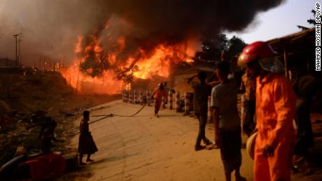Rohingya refugees try to douse a major fire in their Balukhali camp at Ukhiya in Cox&#39;s Bazar district of Bangladesh on Sunday, March 5.