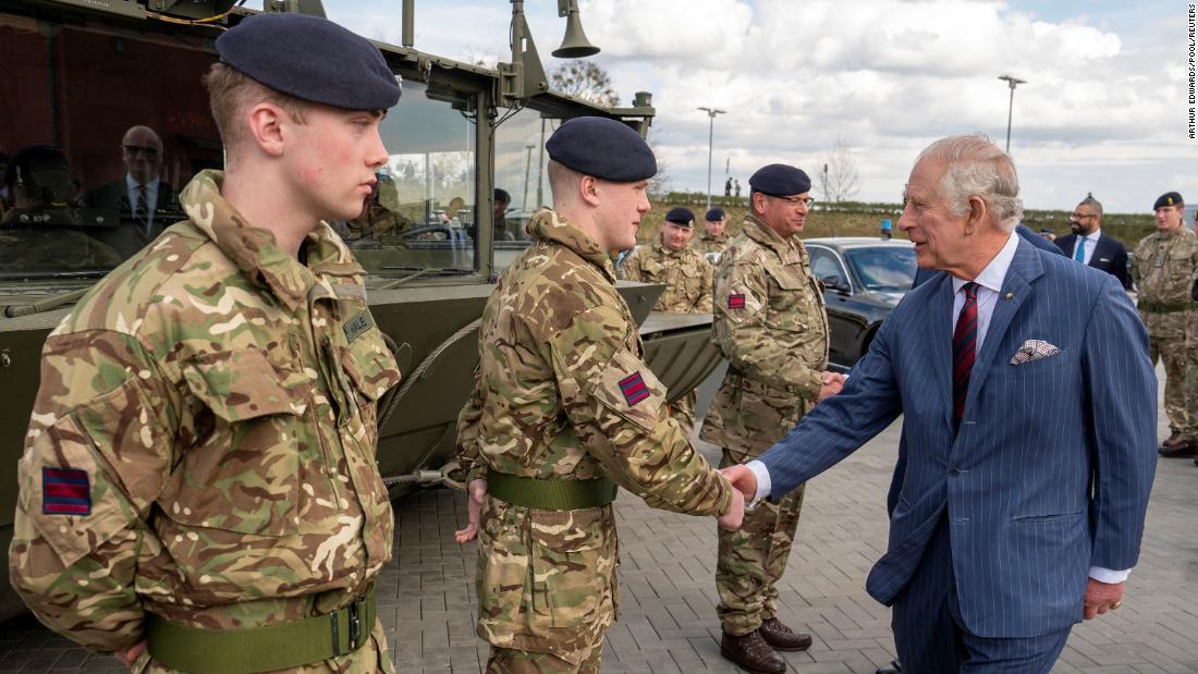 The King greets soldiers during his visit to the Joint Military Unit at Finowfurt, Germany, on Thursday.