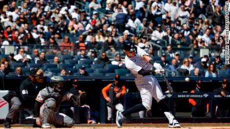 Aaron Judge hits a home run during the first inning against the San Francisco Giants. 
