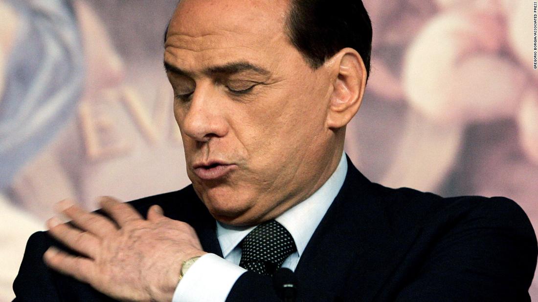 Berlusconi wipes his jacket during a news conference in Rome in 2006. He lost the election that year to Romano Prodi.