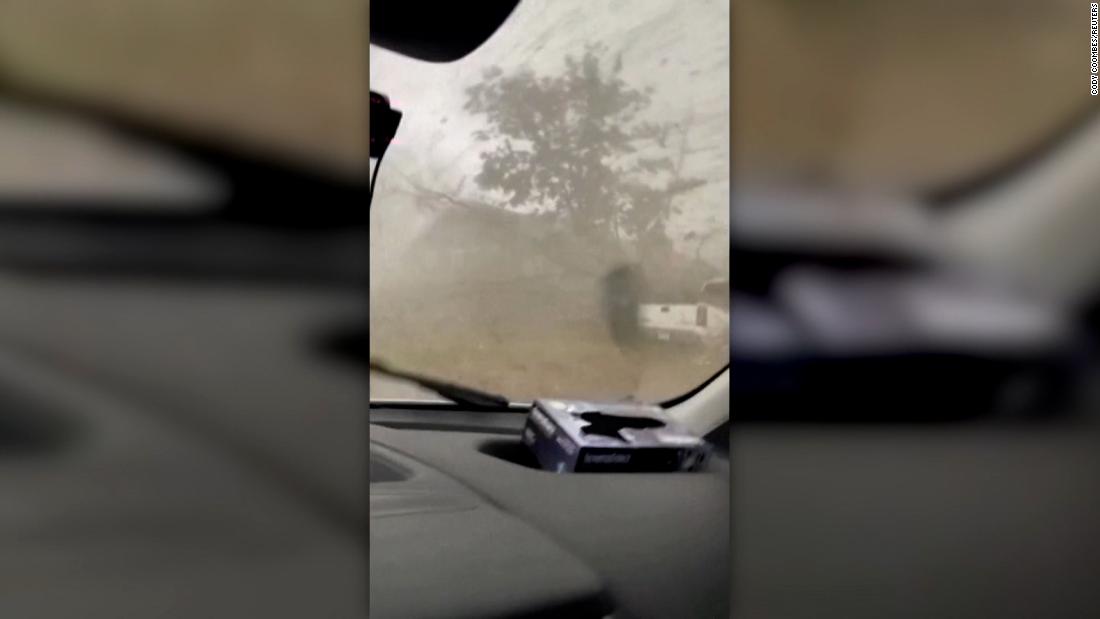 Man rides out tornado inside van. See the footage