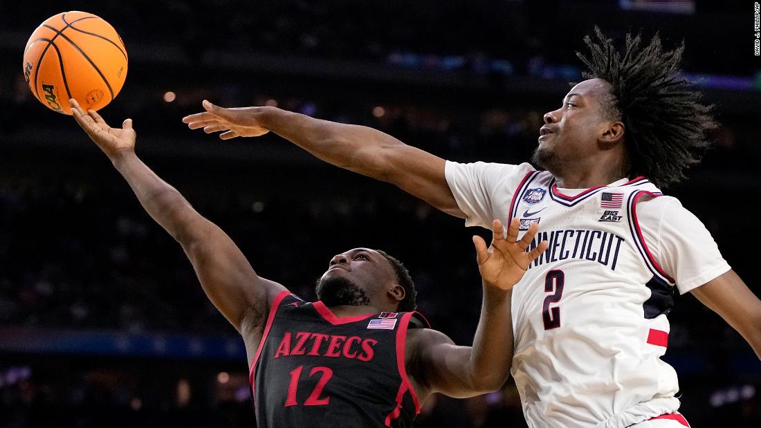 Newton blocks a shot by Darrion Trammell during the second half.