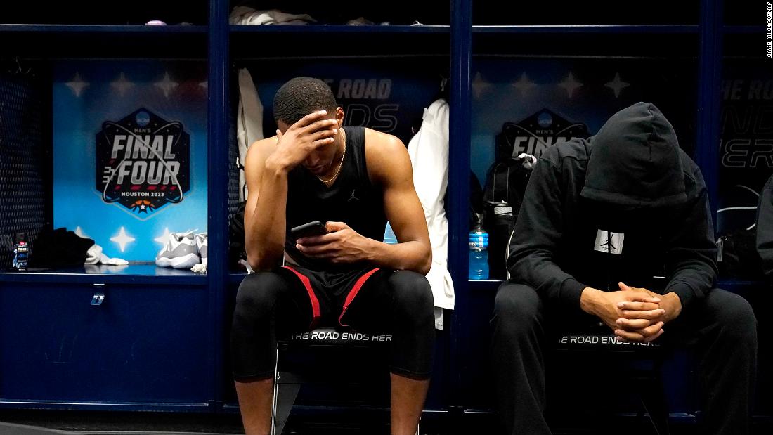 San Diego State&#39;s Micah Parrish and Tyler Broughton sit in the locker room after the game.