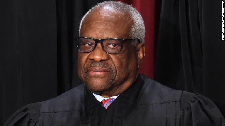 Associate US Supreme Court Justice Clarence Thomas poses for the official photo at the Supreme Court in Washington, DC on October 7, 2022.