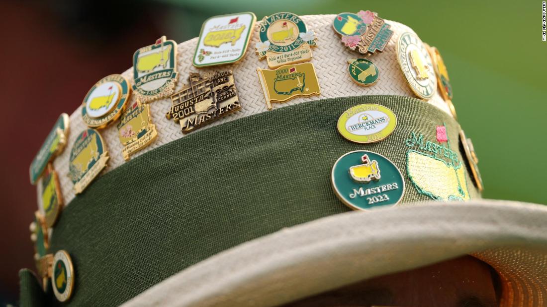 Pins adorn a spectator&#39;s hat on Thursday.
