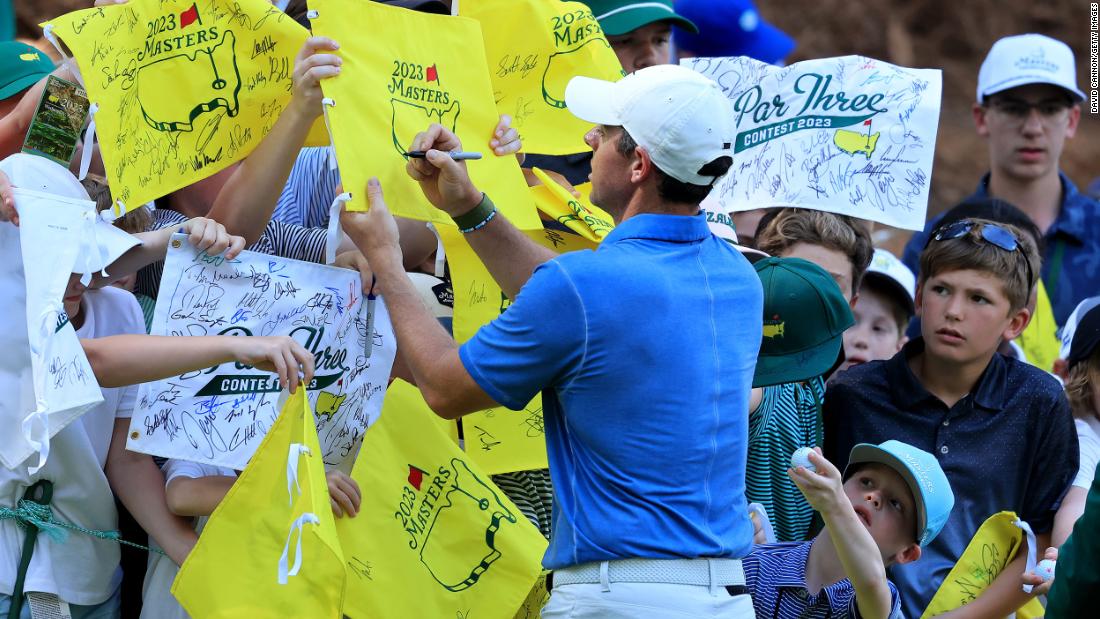 Rory McIlroy signs autographs after competing in the traditional par 3 contest that is held the day before the start of the tournament.