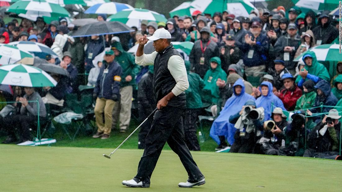 Tiger Woods walks the 18th green during the second round on Saturday, April 8.