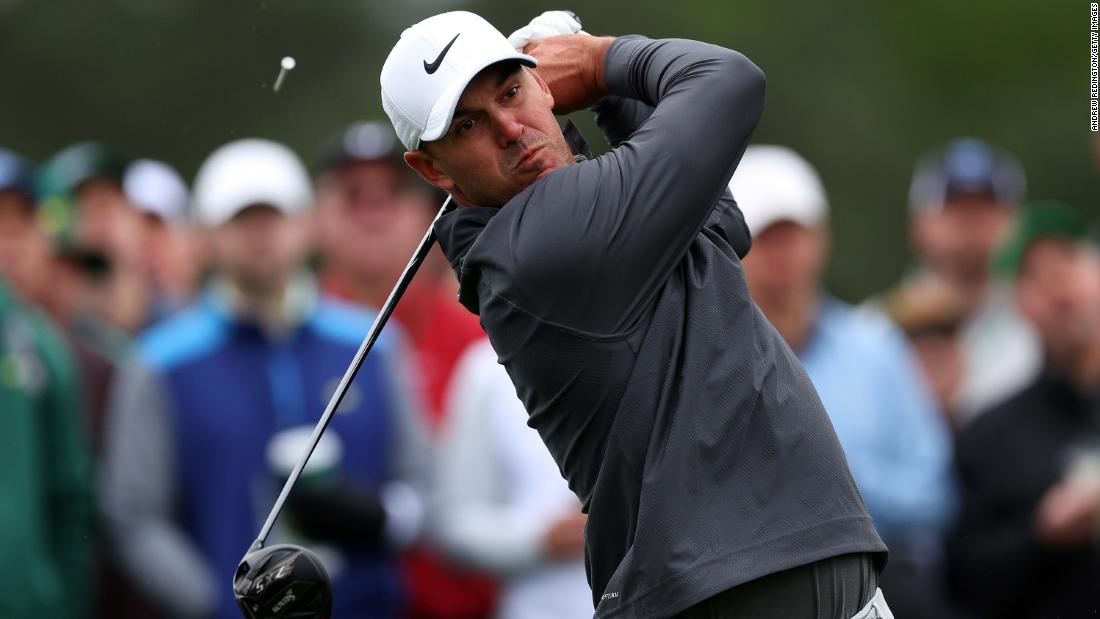 Brooks Koepka plays his shot from the eighth tee during the continuation of the weather-delayed third round on Sunday.
