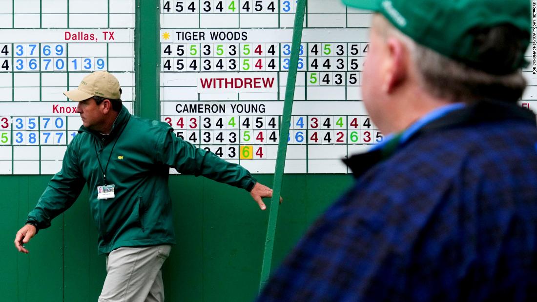 The scoreboard is changed after Tiger Woods withdrew from competition on Sunday. 
