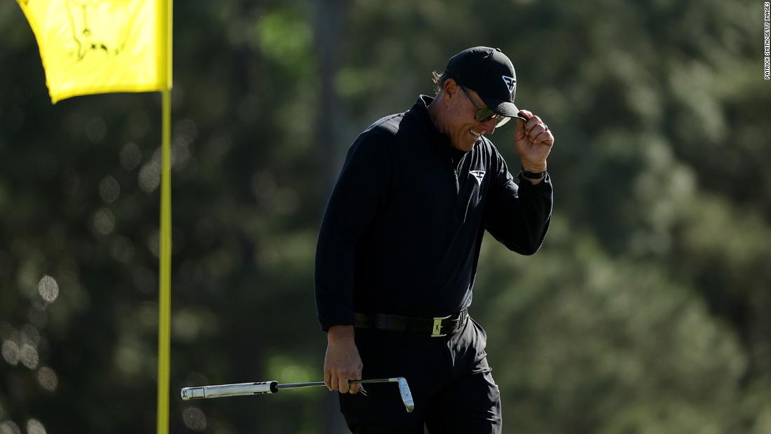 Mickelson reacts on the 18th green during the final round.