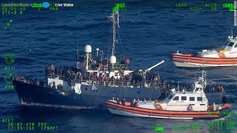 Italian coast guard rescues migrants from rough sea