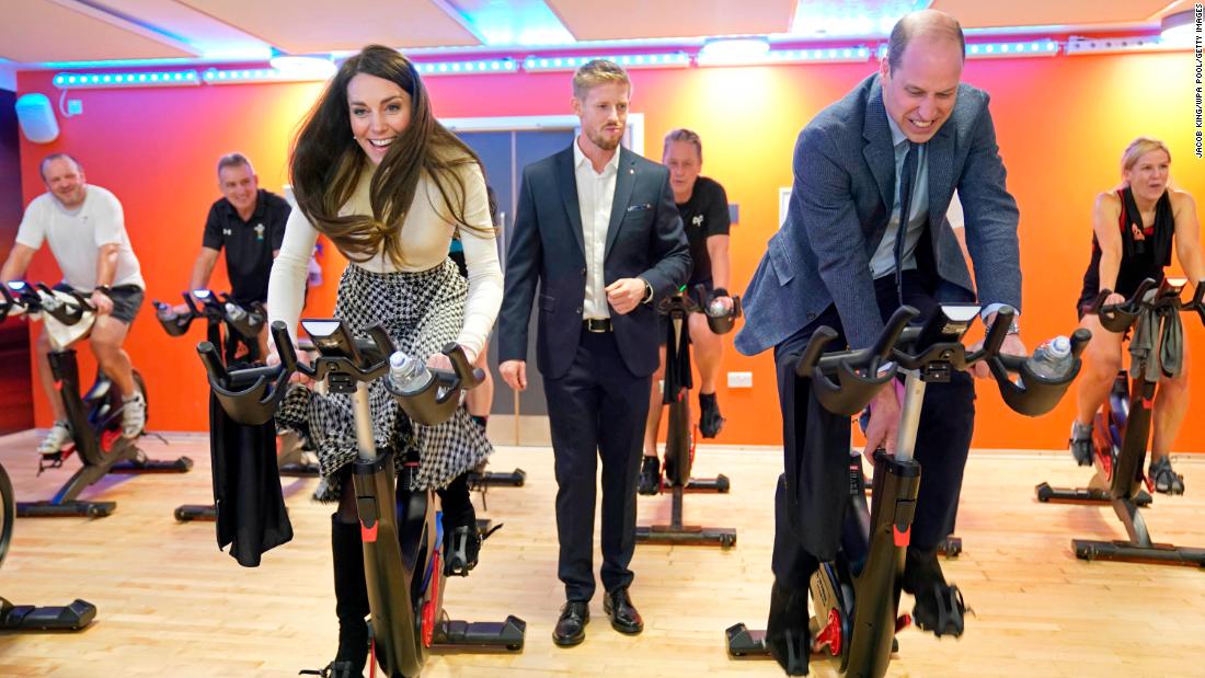 William and Catherine take part in a spin class during while visiting a fitness center in Port Talbot, Wales, in February 2023.