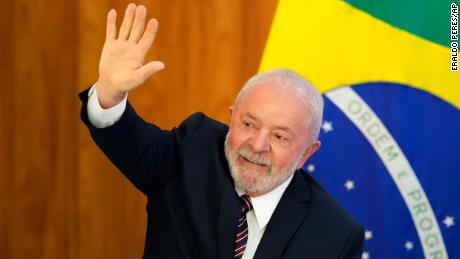 Lula waves as he arrives for a ministerial meeting at Planalto Palace in Brasilia on Monday, April 10, 2023. 